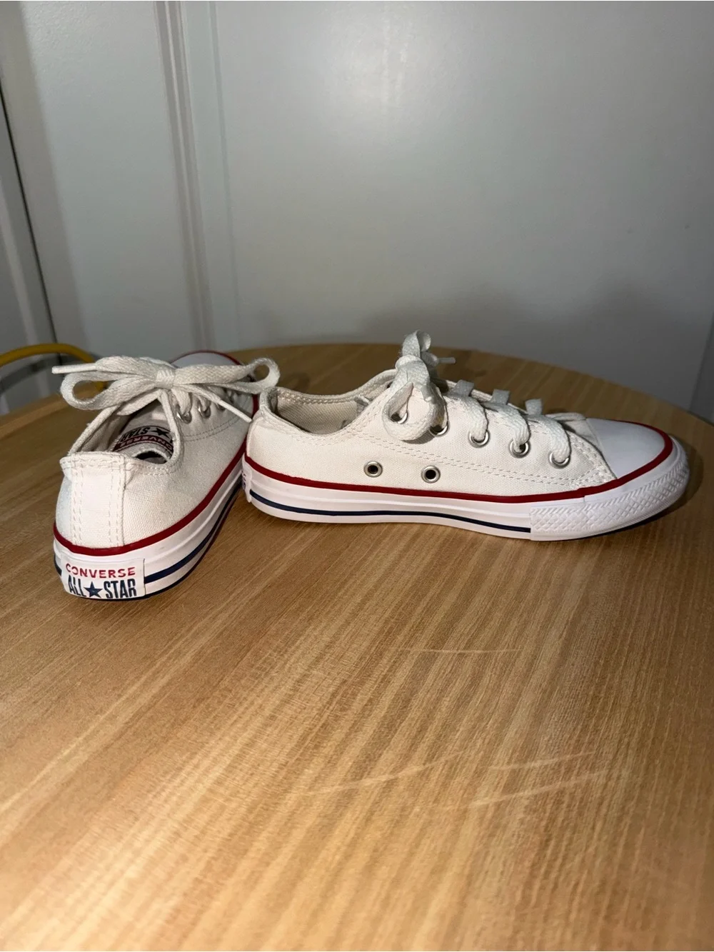 Converse Low Top Canvas Sneakers in White with Red Trim